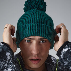 Engineered knit ribbed pom pom beanie